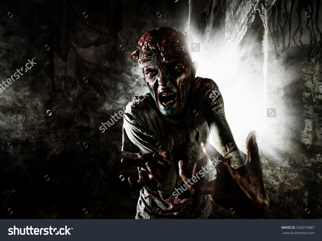 Pic stock photo terrible bloody zombie man with the brains out in search of his victim horror halloween concept 560076883